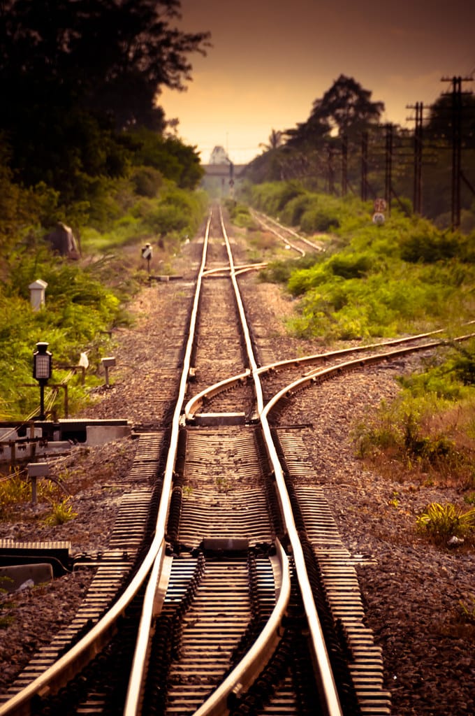 Railroad tracks diverging at a switch — routing each task onto the right path